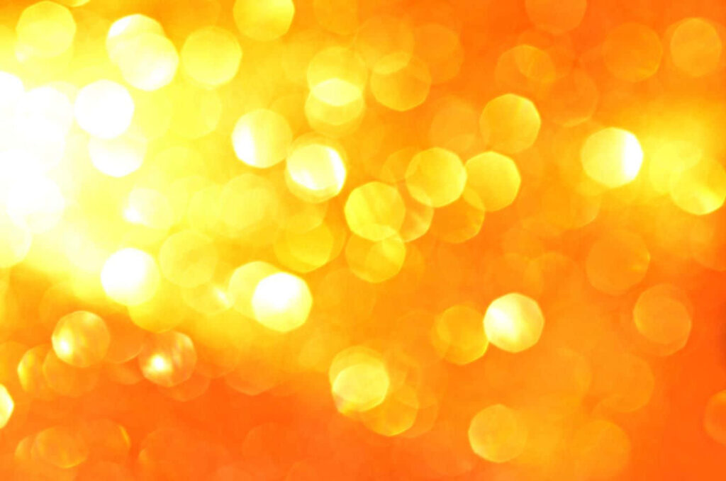Vibrant Orange Background with Yellow Bokeh Effects - Warm Atmosphere Wallpaper