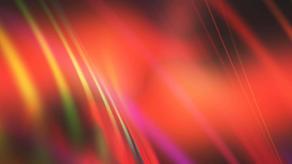 Abstract vibrant orange and light red gradient wallpaper with smooth flowing light streaks background