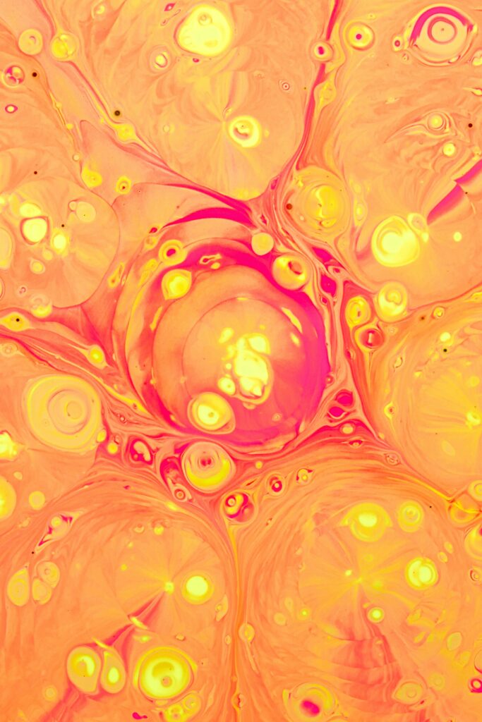 Vibrant Abstract Fluid Art Wallpaper in Warm Orange & Yellow Tones