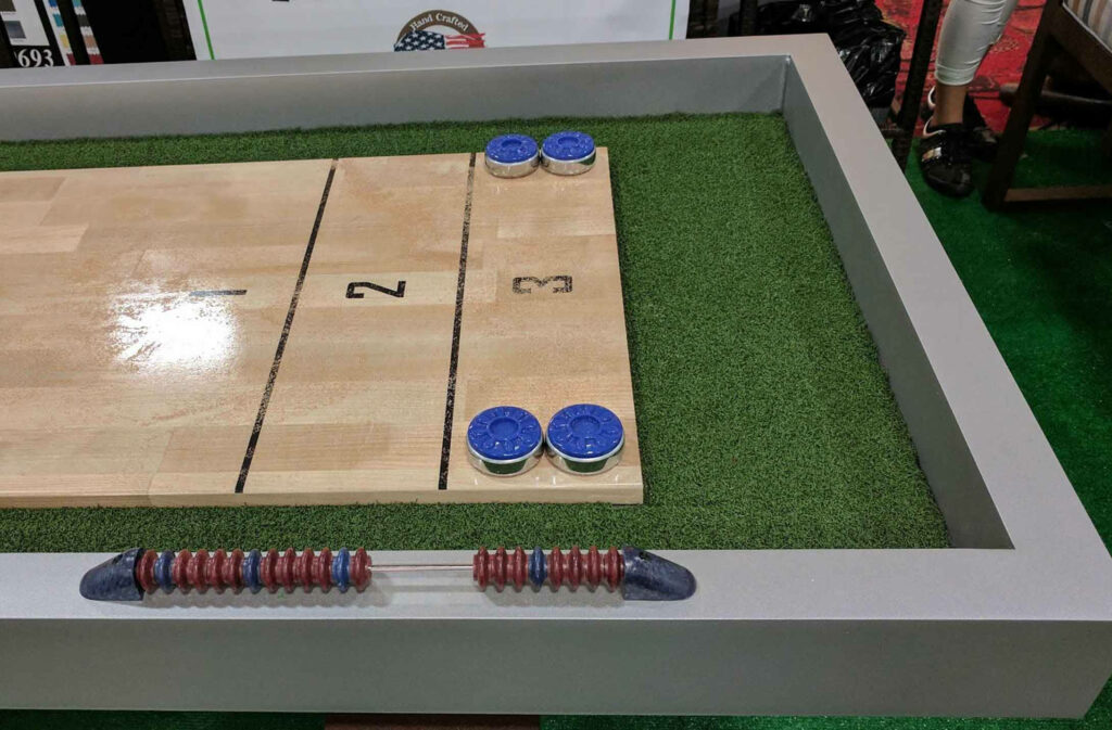 Vibrant Shuffleboard Table Wallpaper: Fun on Lush Green Turf