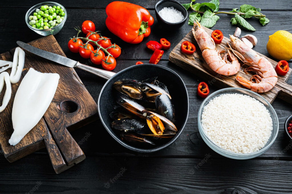 Vibrant Paella Ingredients Wallpaper: Fresh Seafood & Veggies Art
