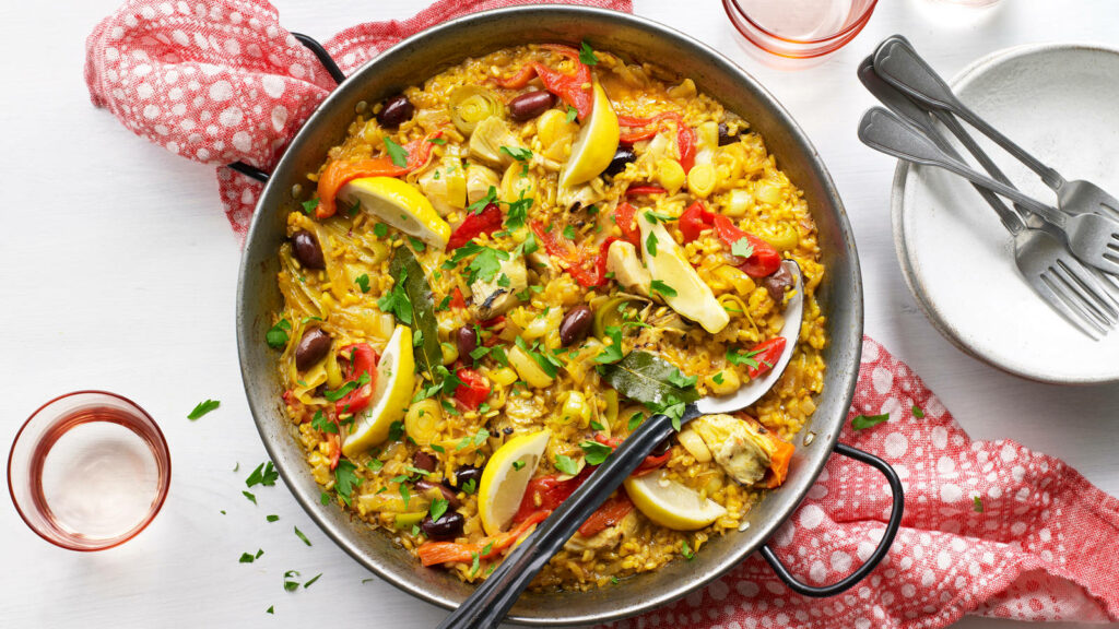 Vibrant Traditional Paella Wallpaper: Colorful Rice Dish Background