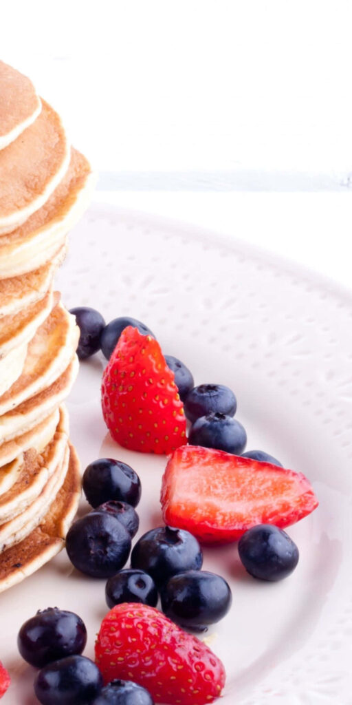 Vibrant Pancake Stack with Blueberries & Strawberries - Food Wallpaper