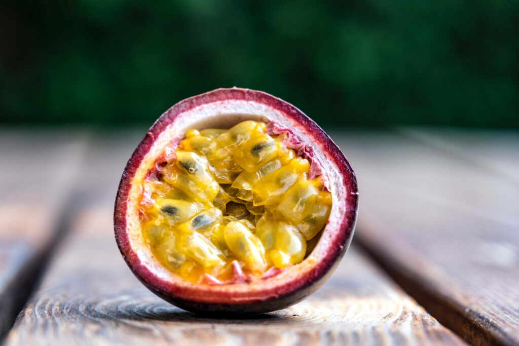 Vibrant Passion Fruit Wallpaper: Juicy Yellow Pulp & Seed Delight