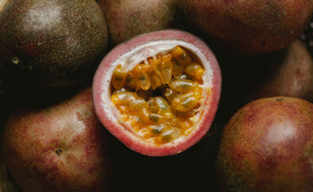 Vibrant Passion Fruit Wallpaper: Fresh Cut with Rustic Appeal