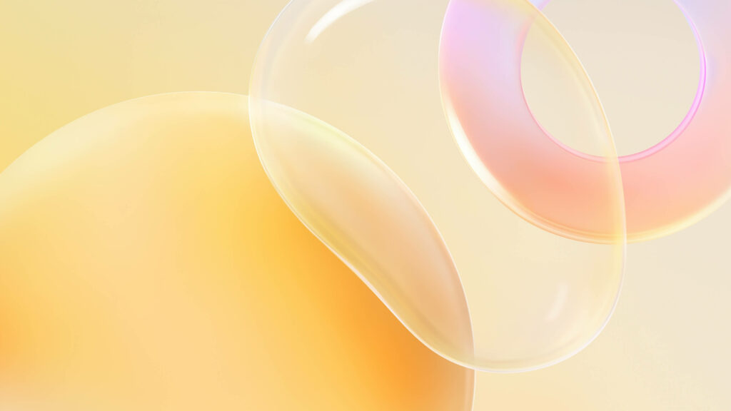 Vibrant Yellow and Pink Circles with a Translucent Bubble on High-Definition Pastel Background Wallpaper