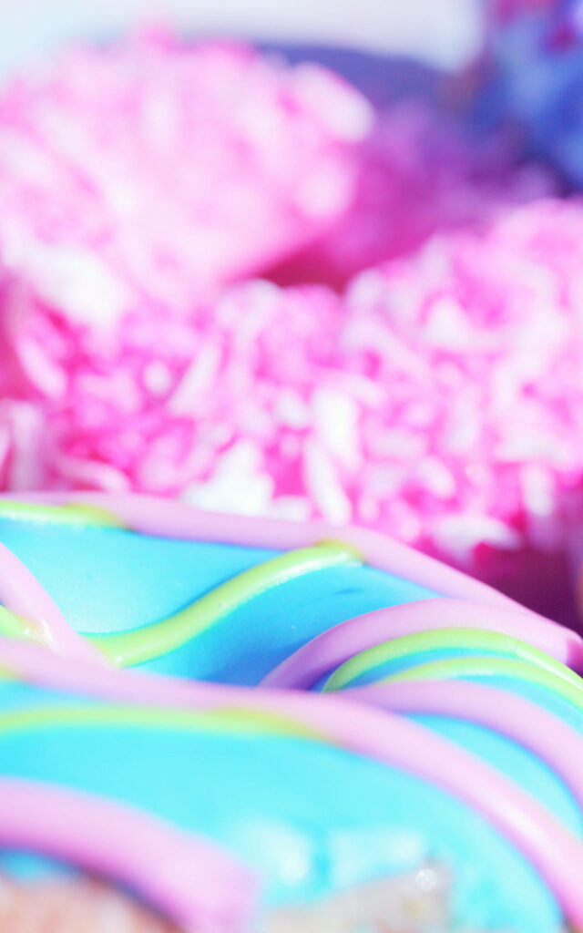 Vibrant Pastel Donut Wallpaper: Colorful Icing & Sprinkles Background