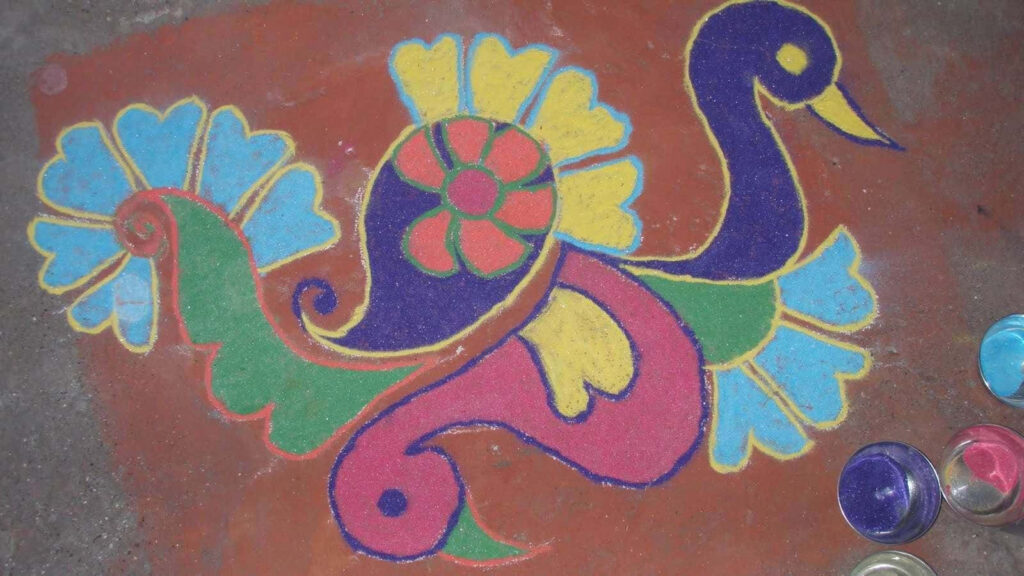 Colorful Peacock Rangoli Wallpaper: Elegant Floral Design Background