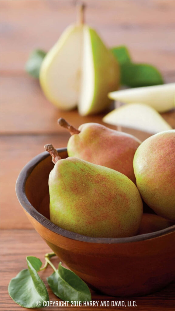 Fresh Juicy Pears Wallpaper: Rustic Charm on Wooden Surface