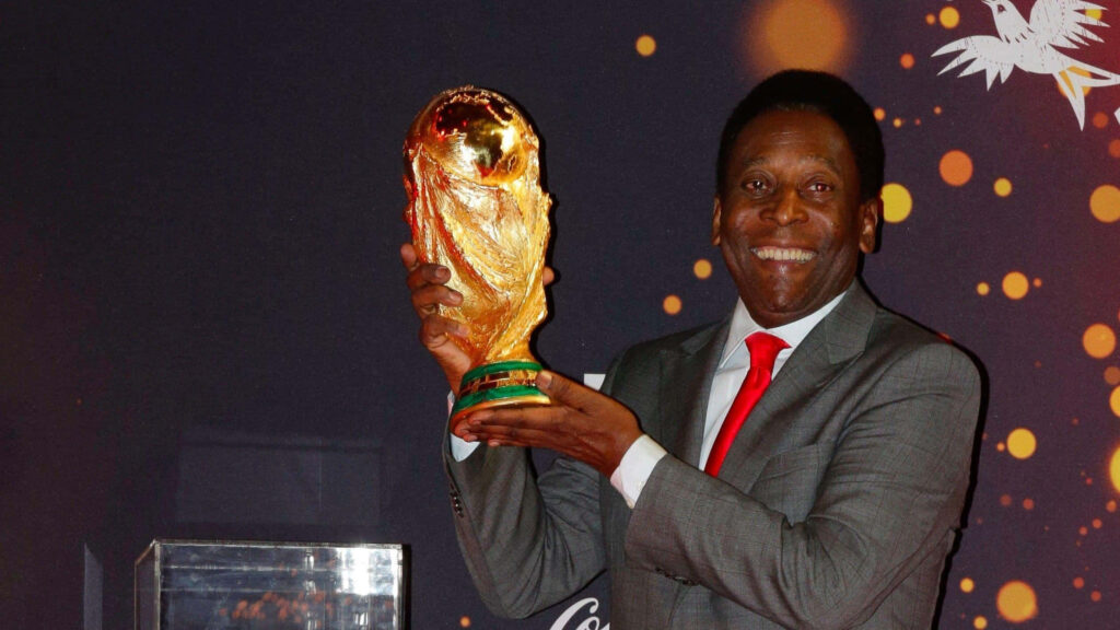 Pelé Celebrating FIFA World Cup: Vibrant Football Wallpaper Background
