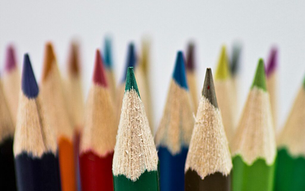 Colorful Pencil Tips Wallpaper: Vibrant Art Background Design