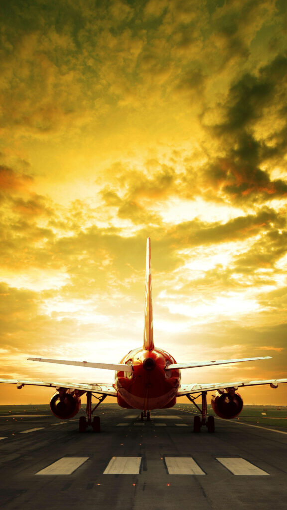 Vibrant Sunrise Vortex: Captivating Red Jet Silhouette in Striking iPhone Wallpaper