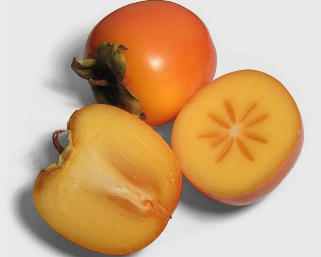 Vibrant Persimmon Wallpaper: Whole & Sliced Fruit on Clean Background