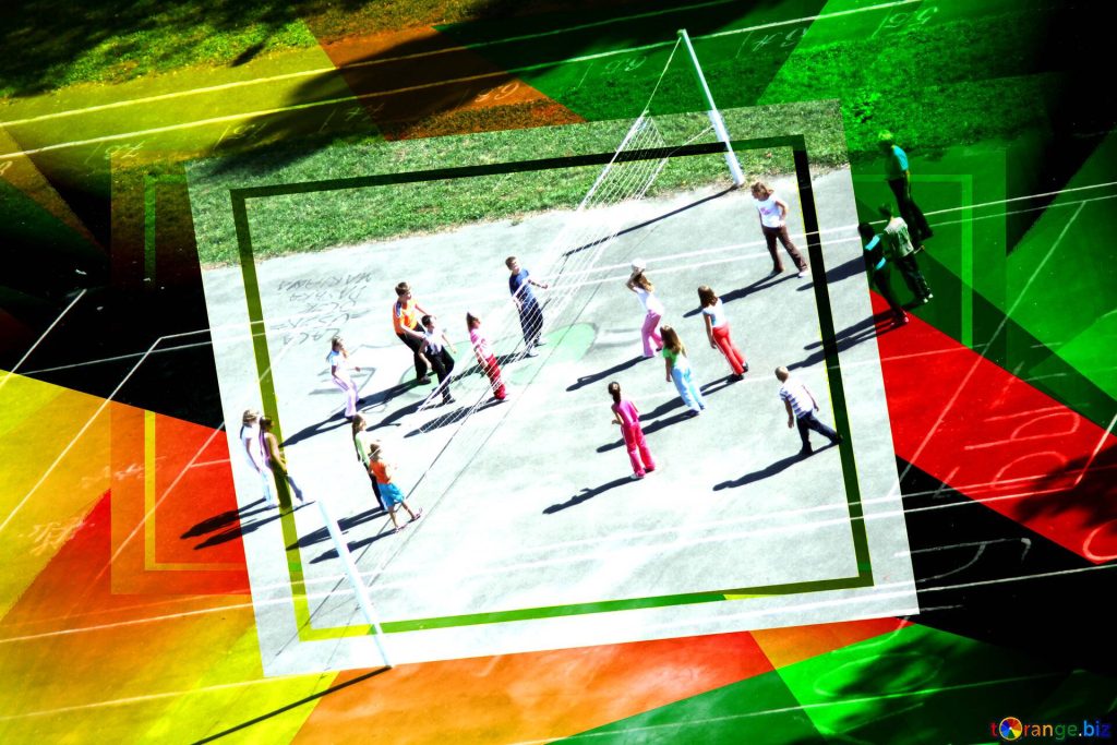 High-angle view of students playing volleyball outdoors with colorful abstract geometric overlay Wallpaper