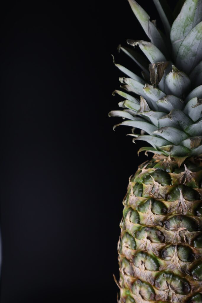Tropical Pineapple Close-Up Wallpaper: Textured Charm on Dark Background