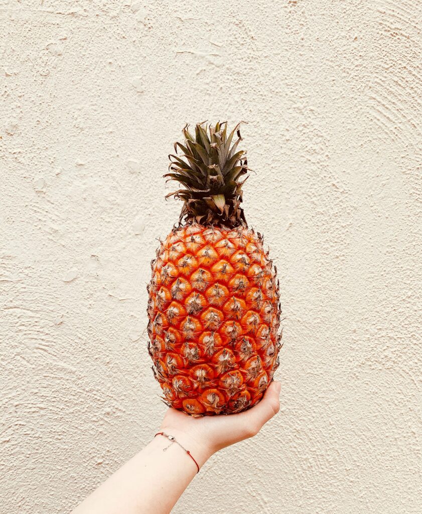 Vibrant Pineapple Wallpaper on Light-Textured Background