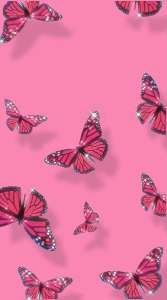 Delicate Pink Butterflies on Soft Abstract Wallpaper Background
