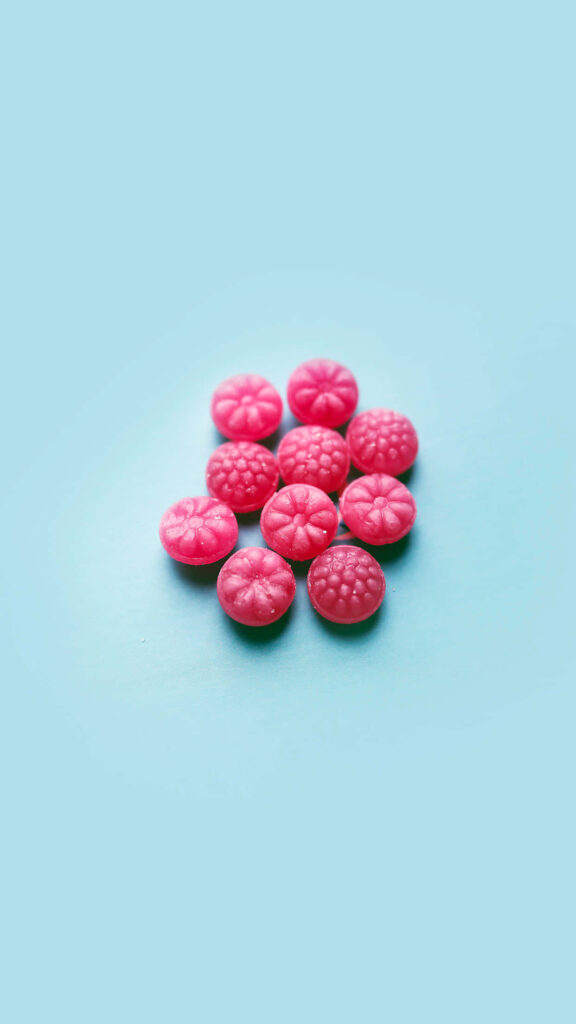 Vibrant Pink Candy Wallpaper: Fun & Sweet Background for Your Phone