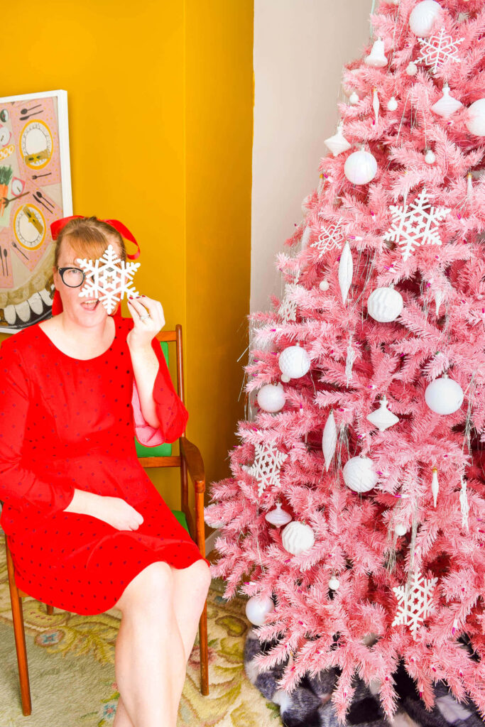 Vibrant Pink Christmas Tree & Retro Charm in Cozy Holiday Scene Wallpaper