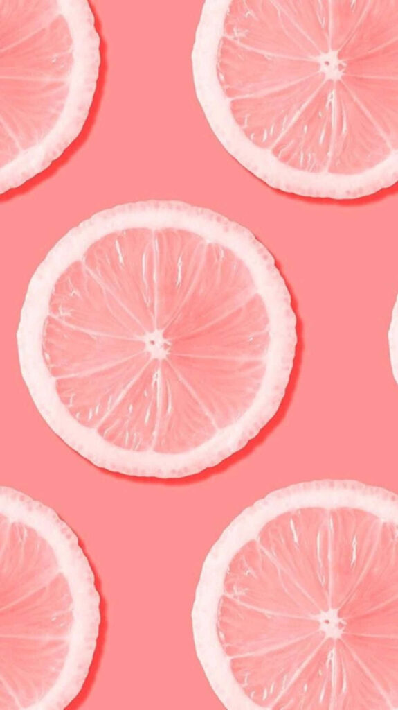 Vibrant Pink Citrus Slice Wallpaper for Cheerful Home Decor