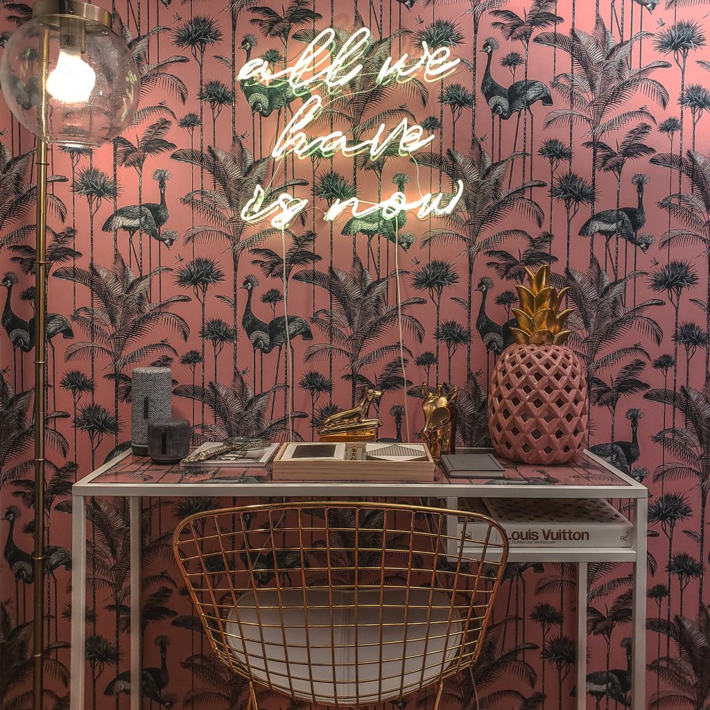 Vibrant pink crane wallpaper neon all we have is now sign stylish chic white desk gold chair