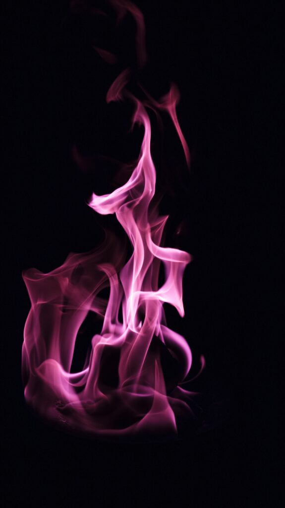 Vibrant Pink Flames on Black Background: Dramatic Wallpaper Art