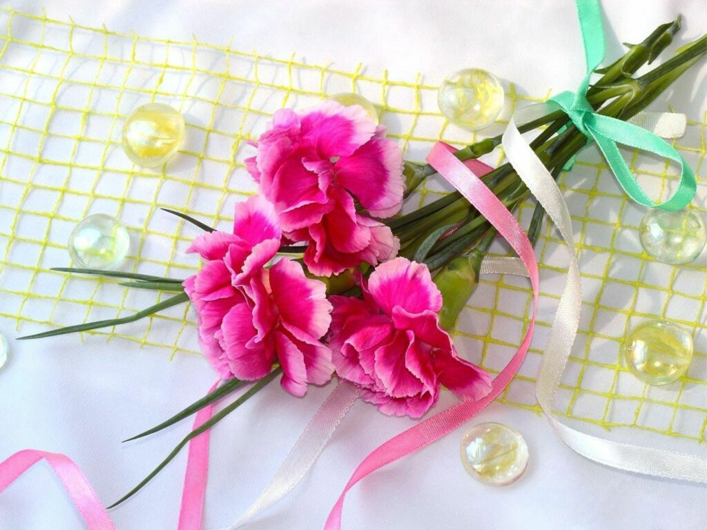 Elegant Pink Flower Wallpaper with Ribbons and Decorative Beads