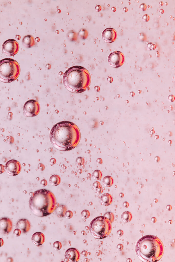 Vibrant Pink Liquid Bubbles Wallpaper - Mesmerizing Macro Design
