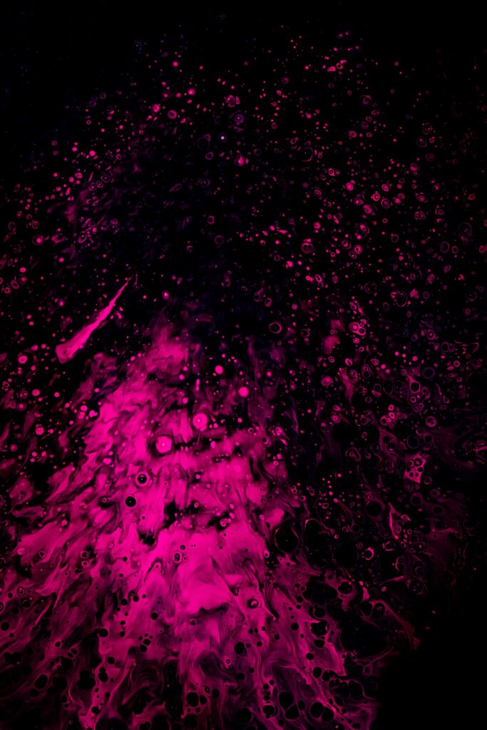 Vibrant Pink Liquid Stains on Black: Bold Abstract Wallpaper