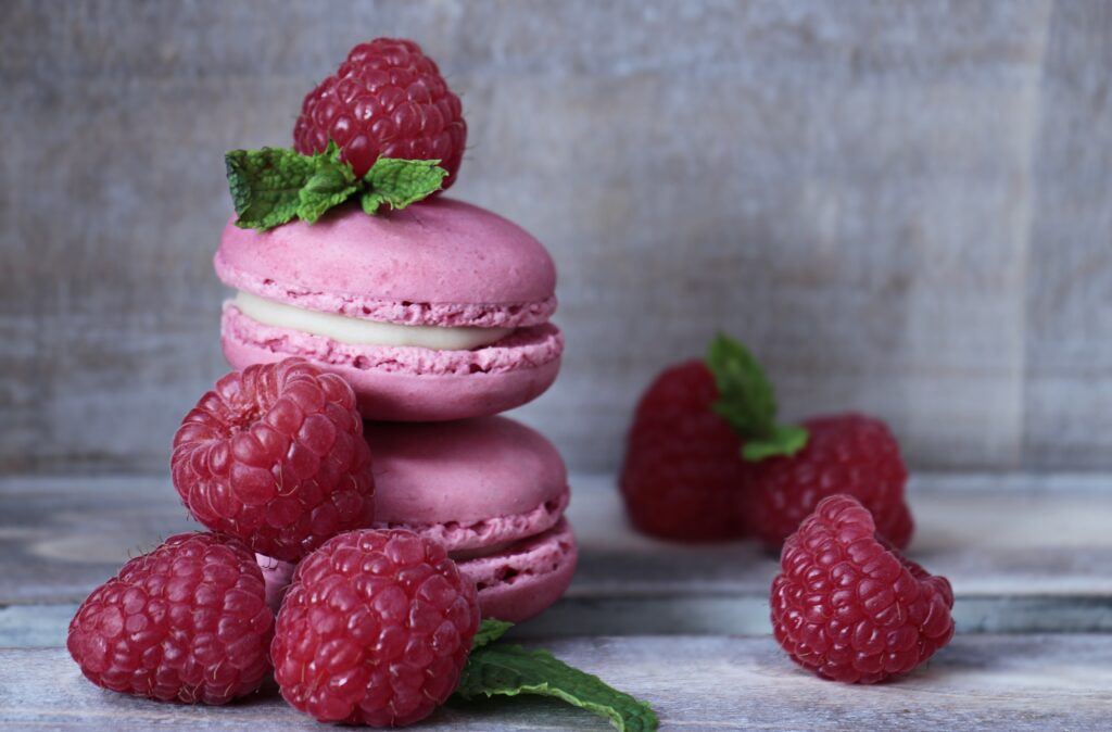 Vibrant Pink Macarons and Raspberries Wallpaper Background