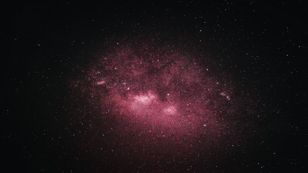 Vibrant Pink Nebula Wallpaper: Mesmerizing Cosmic Background