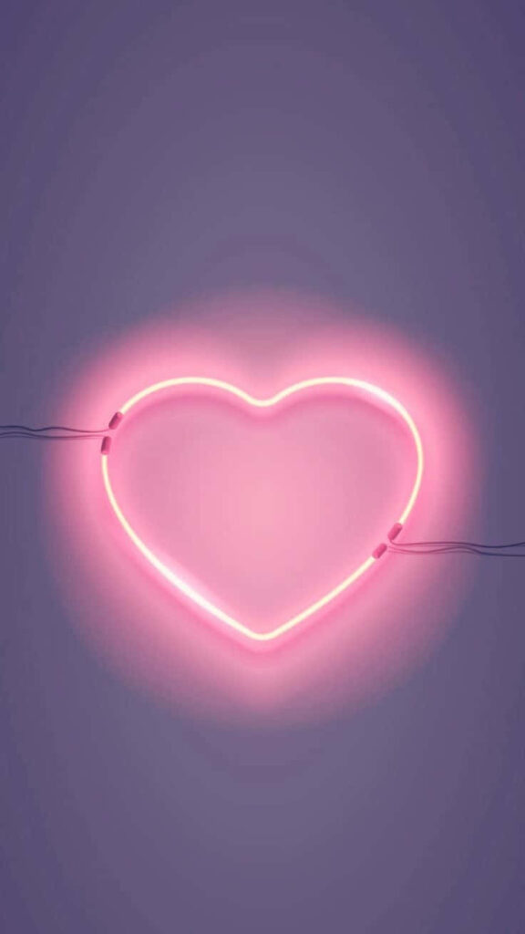 Vibrant Neon Heart Wallpaper: Romantic Pink Glow on Purple Background