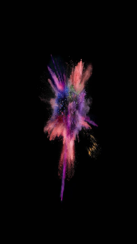 Vibrant pink purple blue powder explosion on black background iPhone wallpaper background