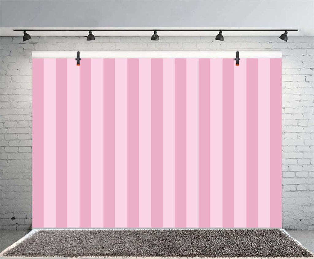 Vibrant pink striped photography backdrop with light and medium vertical stripes on stand Wallpaper
