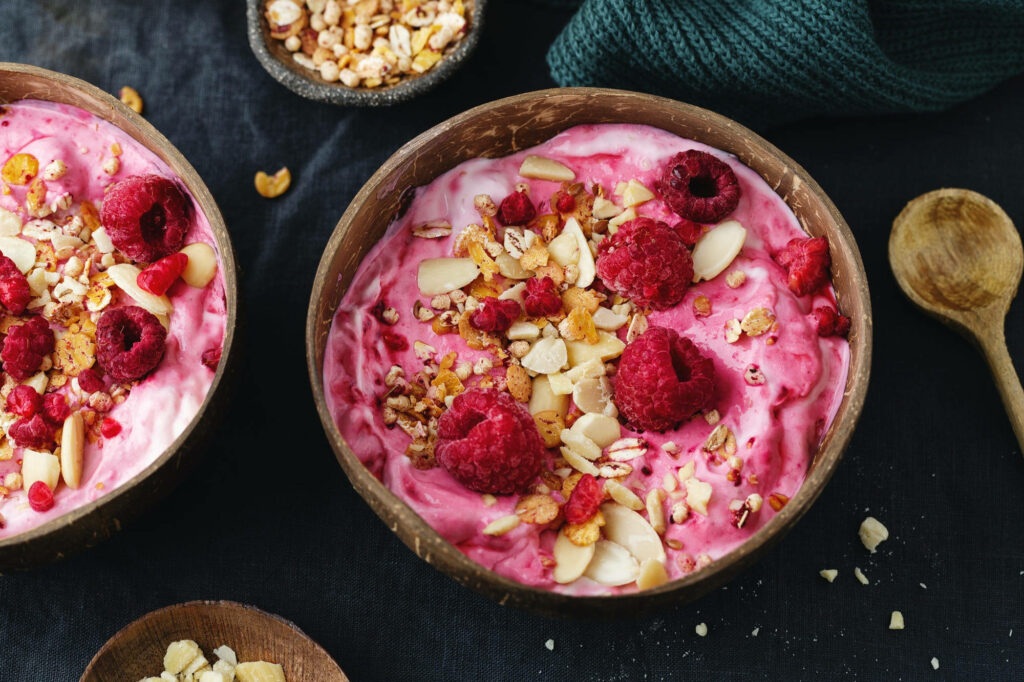 Vibrant Wallpaper: Pink Yogurt with Raspberries & Granola Delight