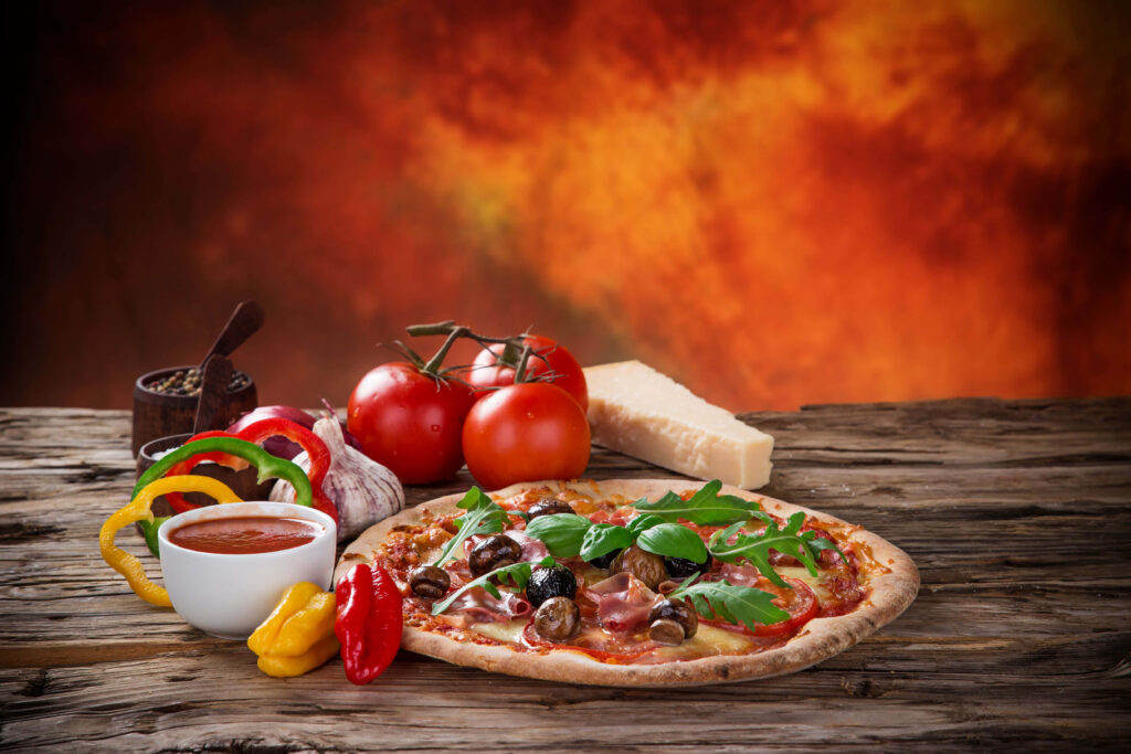 Delicious Pizza Wallpaper: Fresh Ingredients on Rustic Wooden Table