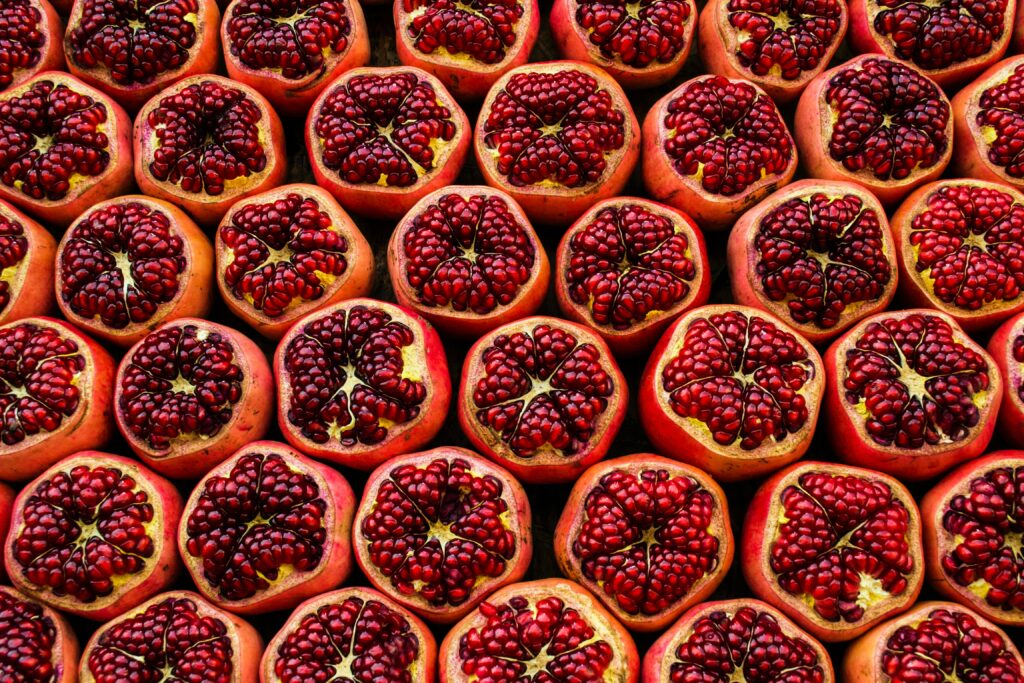 Vibrant Red Pomegranate Wallpaper: Juicy Seeds in Colorful Display