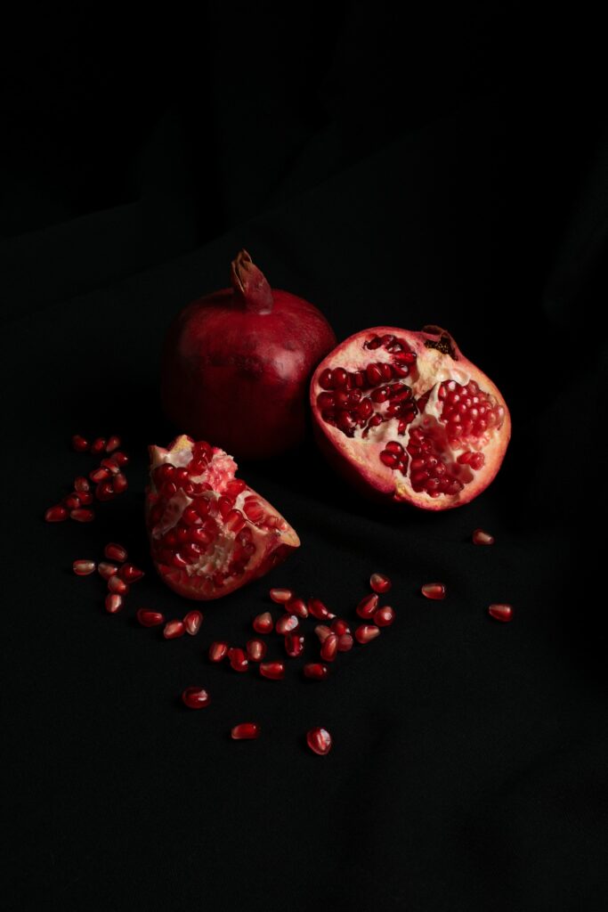 Vibrant Pomegranate Wallpaper - Bold Red on Dark Background