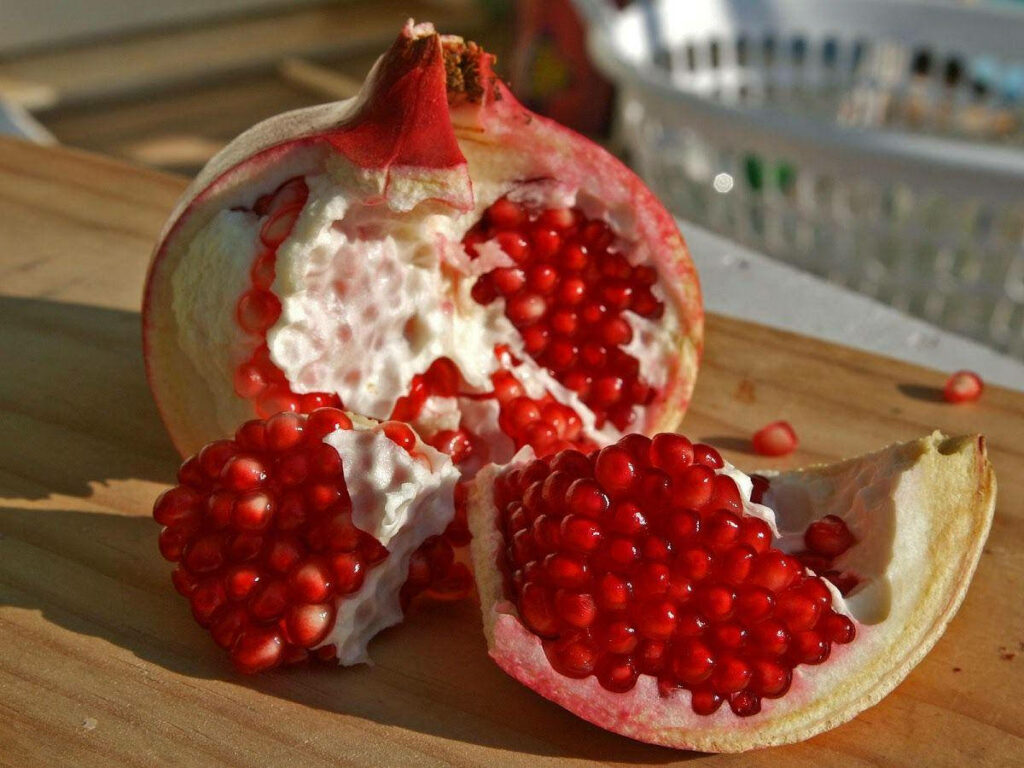 Vibrant Pomegranate Wallpaper: Fresh Red Seeds & Natural Beauty