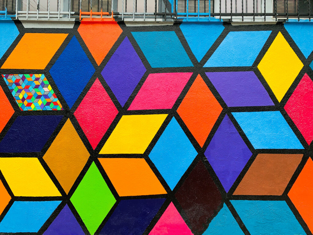 Vibrant pop art wallpaper with bold colorful interconnected squares and modern geometric pattern
