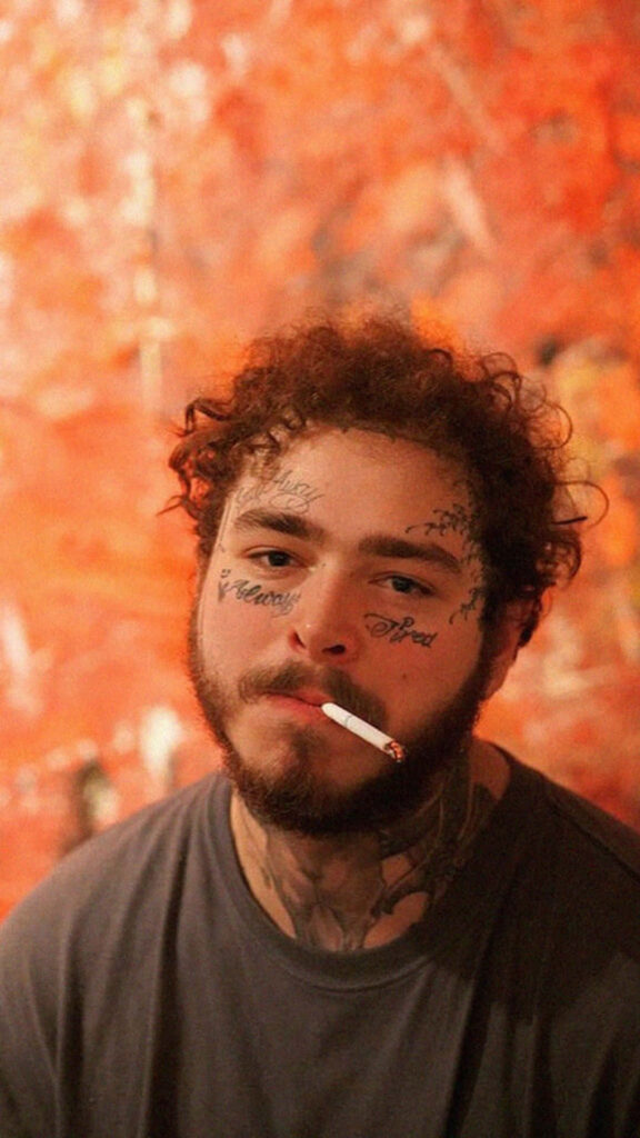 Vibrant Post Malone Wallpaper: Artist in Contemplative Pose