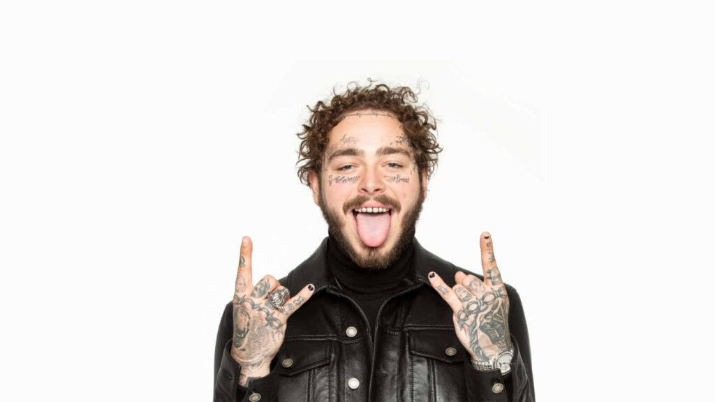 Vibrant Post Malone Wallpaper: Cheerful Pose in Leather Jacket