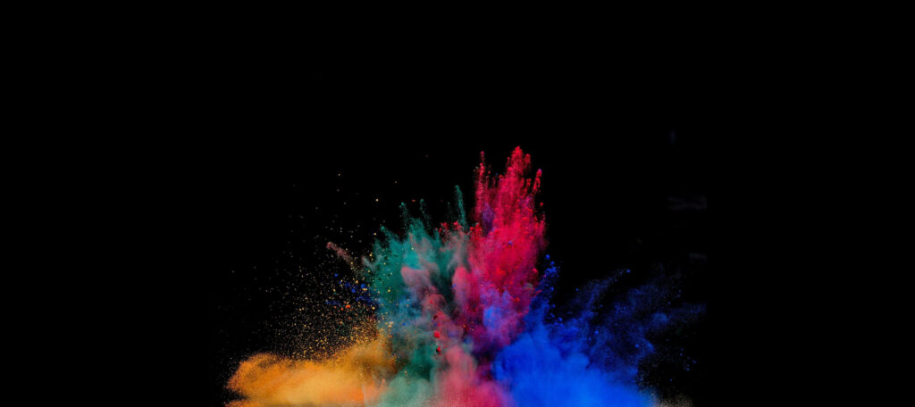 Vibrant Amoled Display: Mesmerizing Multicolored Powder Burst on 4k Desktop Wallpaper