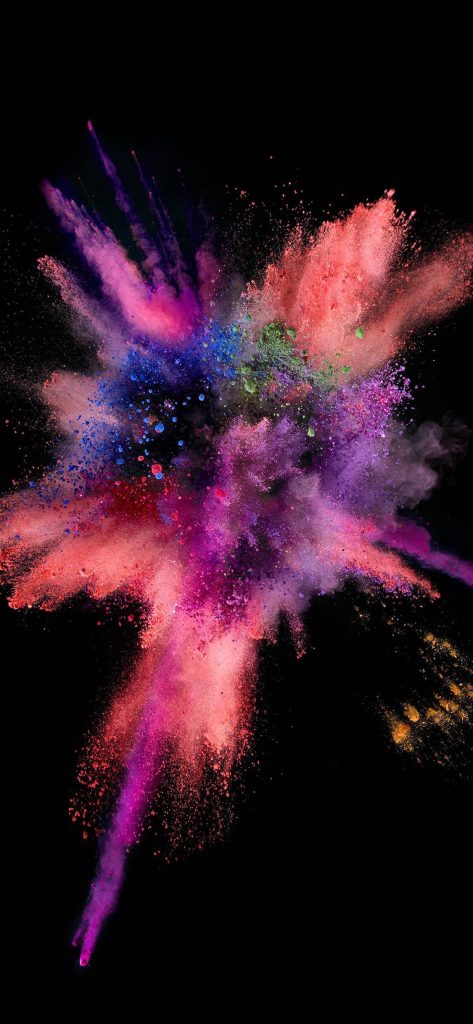 Vibrant pink purple and blue powder explosion iPhone wallpaper with dynamic dust burst on black