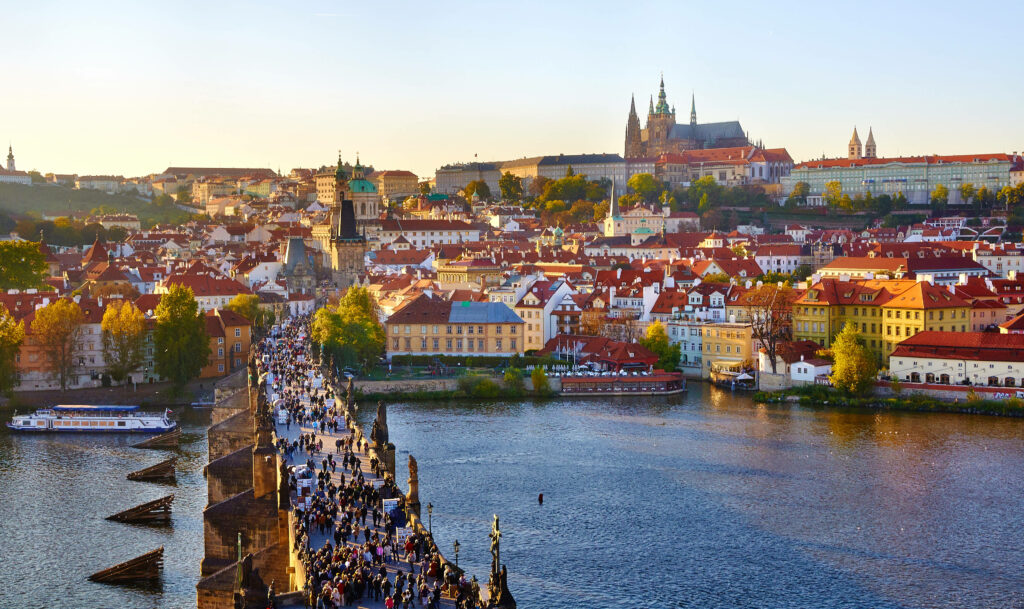 Vibrant Prague Spring Wallpaper: Charles Bridge & Golden Sunset