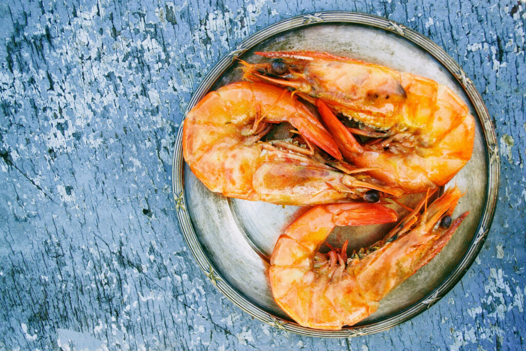 Vibrant Prawn Wallpaper: Bright Orange on Rustic Silver Plate
