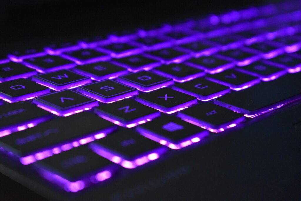 Stunning Purple Backlit Keyboard Wallpaper for Tech Lovers