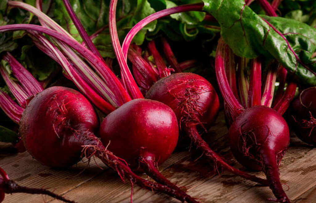 Vibrant Purple Beetroot Wallpaper with Rustic Wooden Background