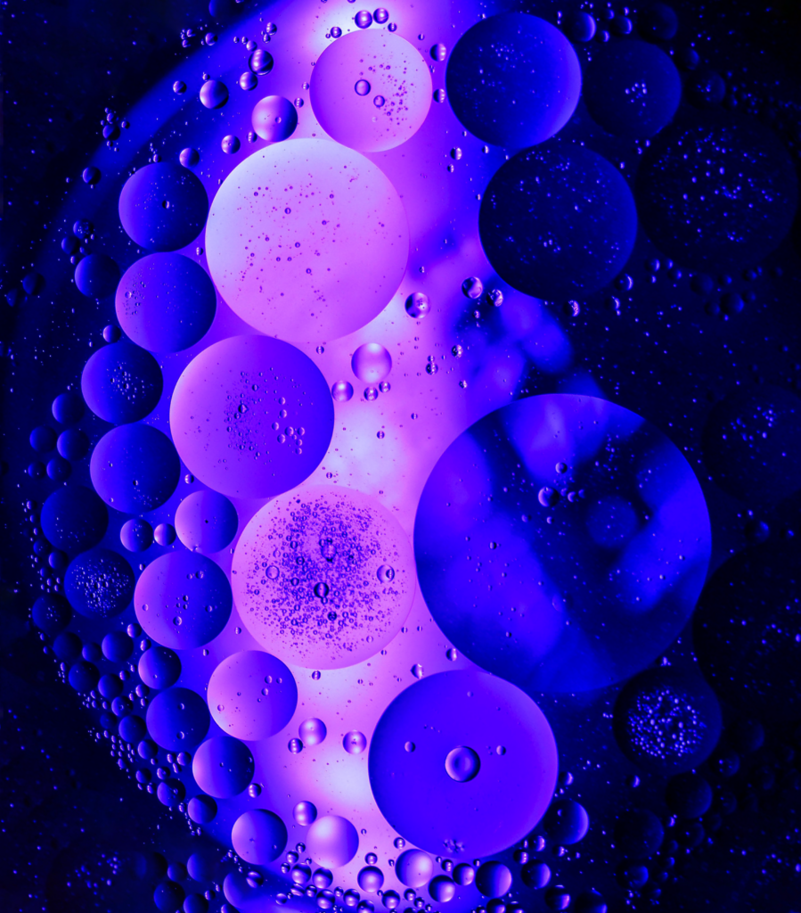 Vibrant Purple Bubble Wallpaper: Abstract Dark Background Design