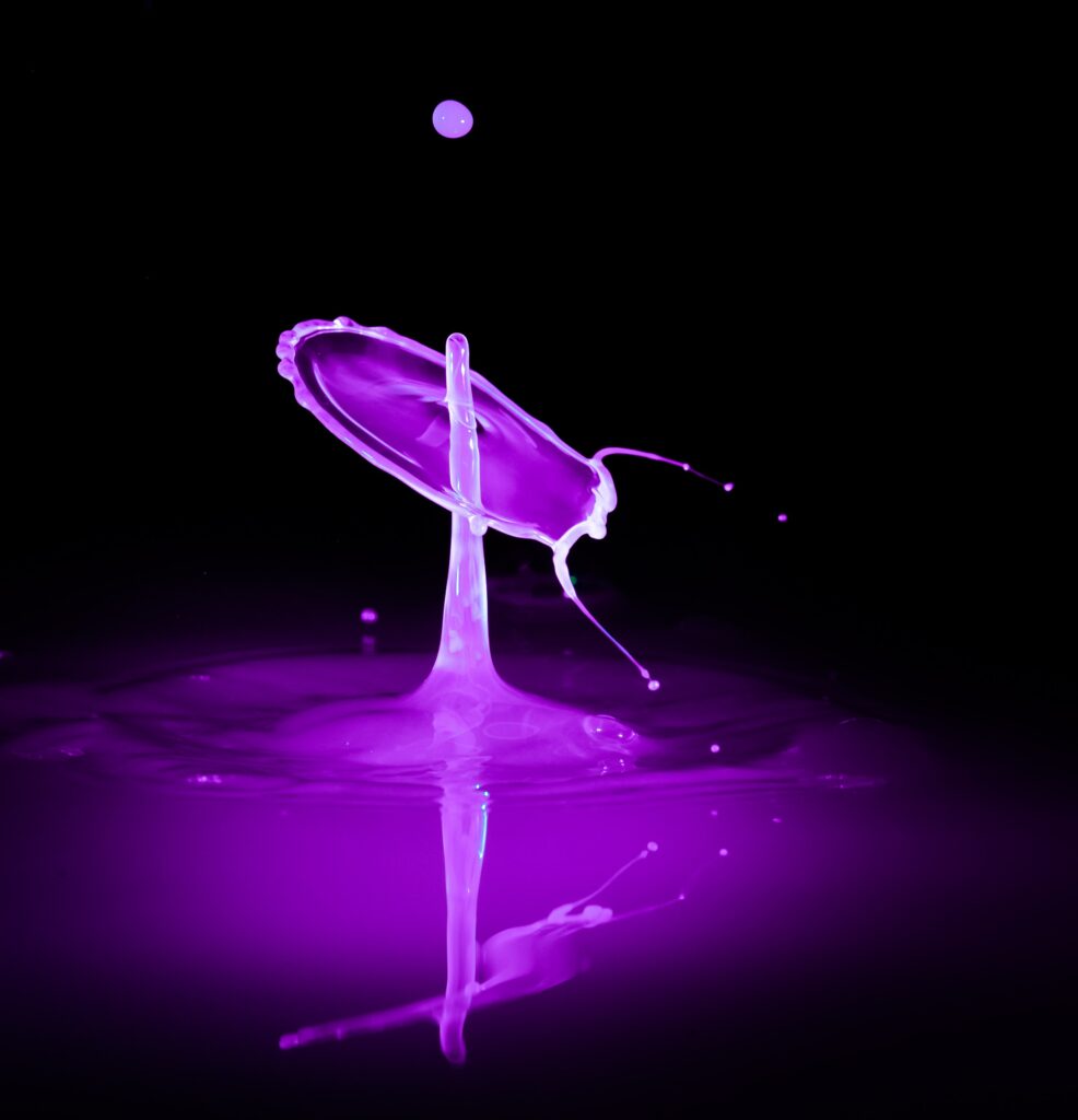 Vibrant Purple Liquid Splash - Intricate Macro Wallpaper Background
